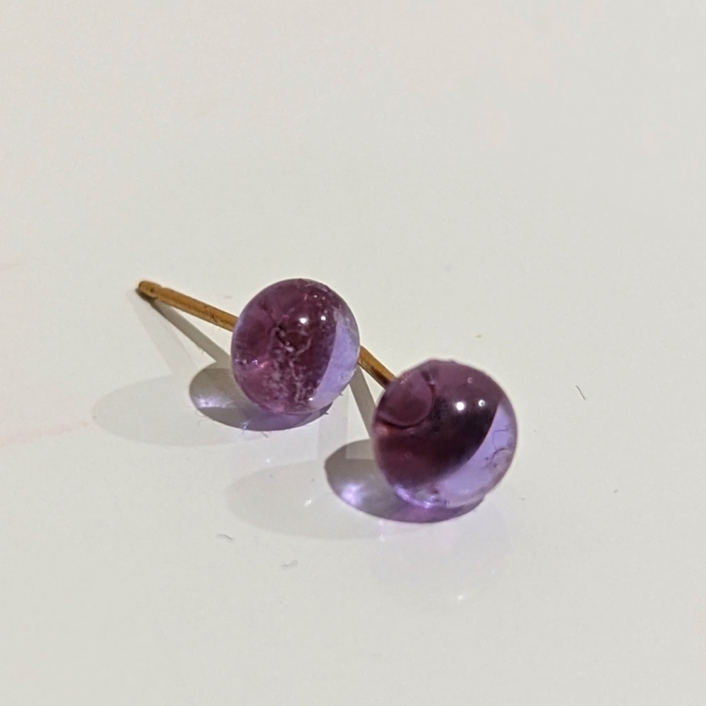 Artisan Handmade lavender transparent colored glass gold studs. .25cm in size